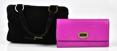 GIANNI VERSACE; a black suede handbag embellished with multicoloured pink, blue, yellow and cream