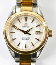 OMEGA; a lady's Seamaster Aqua Terra bicolour wristwatch with mother of pearl dial, date aperture