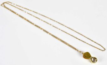 A 15ct yellow gold long guard with spring clasp, length 140cm, approx. 35g, supporting a yellow