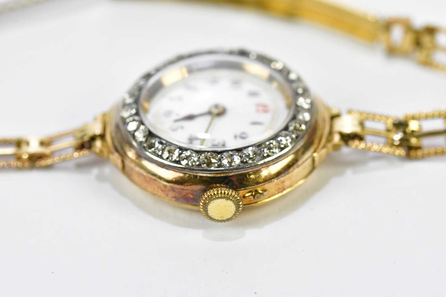 An early 20th century 18ct yellow gold wristwatch with Arabic numerals to the white enamel dial, - Image 5 of 6