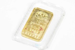 A small Johnson Matthey 10grammes gold 9999 grade 'bar', no.008645, encapsulated.