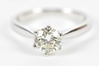 An 18ct white gold diamond solitaire ring, the six claw set round brilliant cut stone approx 1ct,