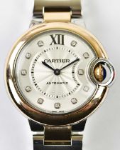 CARTIER; a lady's stainless steel and 18ct rose gold 'Ballon Bleu' wristwatch with diamond hour