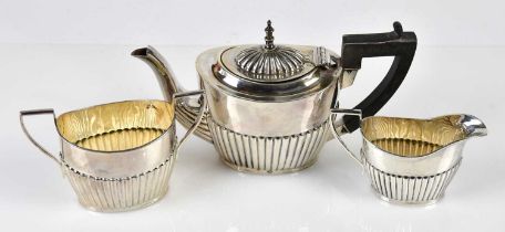 WILLIAM AITKEN; an Edward VII hallmarked silver three piece bachelor service, with gadrooned