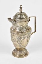 A Continental .935 grade silver coffee pot with repousse decoration and mask head scrolling detail