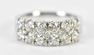 An 18ct white gold diamond half eternity ring set with twelve round brilliant cut diamonds,