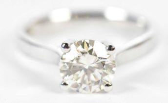 An 18ct white gold diamond solitaire ring, the four claw set round brilliant cut stone 1.52cts,