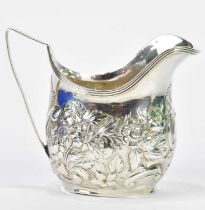 THOMAS MERITON (PROBABLY); a George III hallmarked silver cream jug with repoussé floral