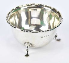 MAPPIN & WEBB; a George V hallmarked silver sugar bowl with cast rim and hoof feet, Birmingham 1915,