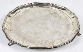 OLLIVANT & BOTSFORD; a George V silver salver of circular form with raised rim and three spreading