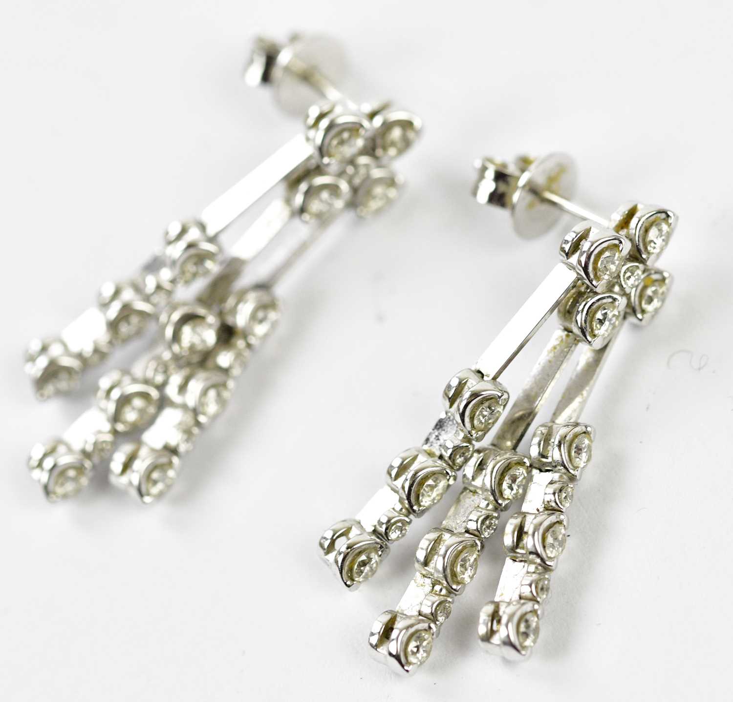 A pair of 18ct white gold diamond drop earrings, each set with twenty round brilliant cut diamonds