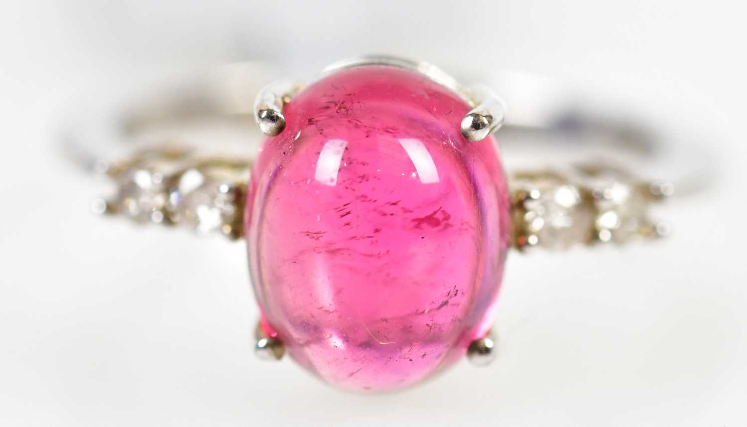 A 9ct white gold rubellite and four stone diamond ring, size N 1/2, approx. 2.9g.