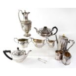 A quantity of late 19th/early 20th century plated ware to include a claret jug with repoussé and