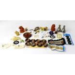 A collectors' lot comprising Wade Whimsies, a Banksia nut brooch, etc.