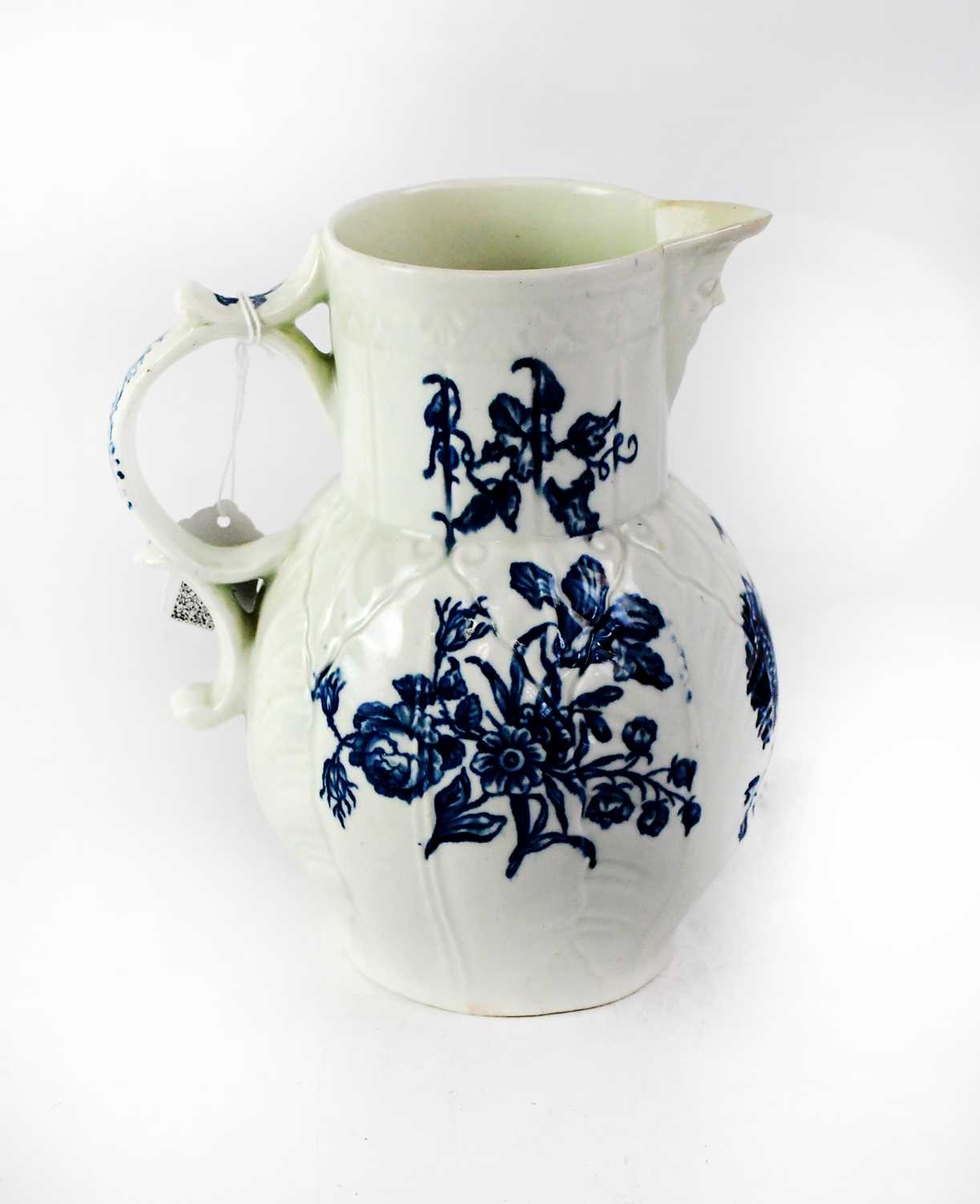 WORCESTER; a c.1790 blue and white floral cabbage leaf mask head jug, height 21.5cm.