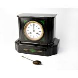 A late 19th century slate eight-day mantel clock with malachite inserts, the white dial set with