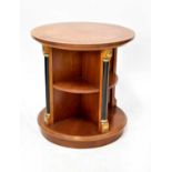 A modern walnut veneered circular top revolving bookcase in the Empire style, height 70cm,