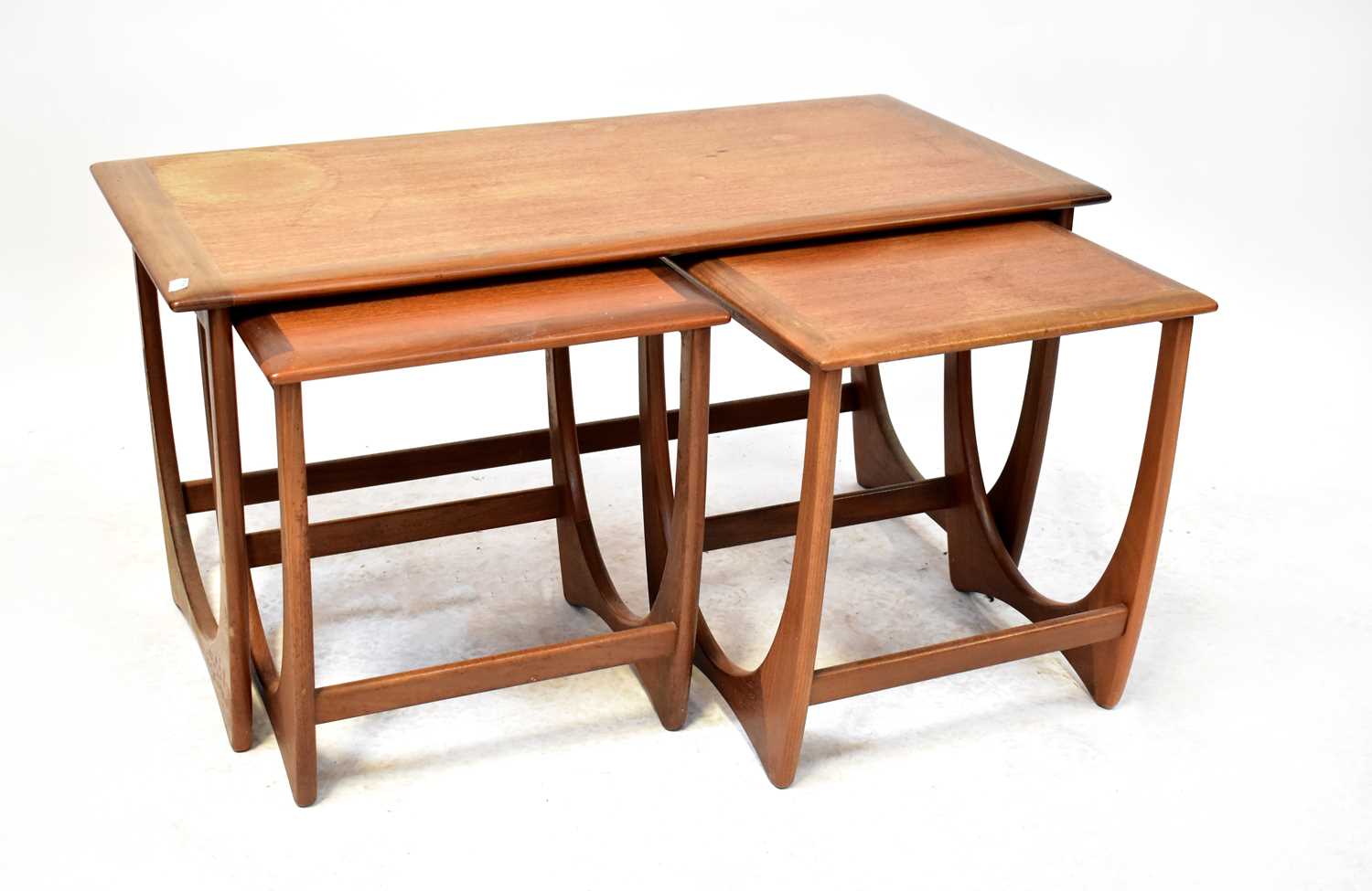 G PLAN; a 1960s retro teak 'Astro' nest of three tables, largest 51 x 100 x 49cm.