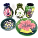 MOORCROFT; five items of cabinet size pottery comprising three small vases, the largest example with