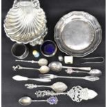 Various items of silver plated ware to include a shell dish with fluted body, raised on three