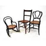 Three chairs comprising a Victorian ebonised mother of pearl inlaid bedroom chair with bergère seat,