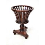 A reproduction mahogany jardinière of brazier form to tripartite base on three ball feet, 70 x