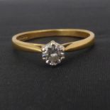 A 18ct gold solitaire diamond ring, the central brilliant cut stone approx. 0.2ct, in white gold