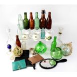 A mixed lot of collectors' items to include glass fishing floats, various bottles, decanters,