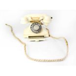 GPO; an ivory-coloured Bakelite telephone with drawer, serial no. 1/232CB S56/2.