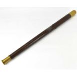 A 19th century wood and brass truncheon or nightwatchman's night stick, with brass capped ends,