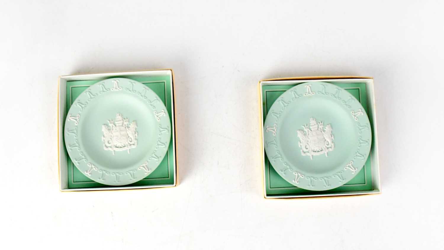 WEDGWOOD; a pair of limited edition commemorative Lloyds of London Centenary 1688-1988 dishes in