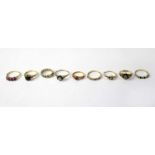 Nine 9ct yellow gold rings set with various coloured stones, combined approx. 19.8g (9).