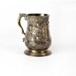 A George II silver mug of baluster form, the base inset with a contemporary coin, the body later