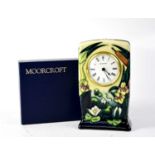 MOORCROFT; a mantel clock with green and blue drip glaze, tube lined 'Water Lilies and Bulrush'