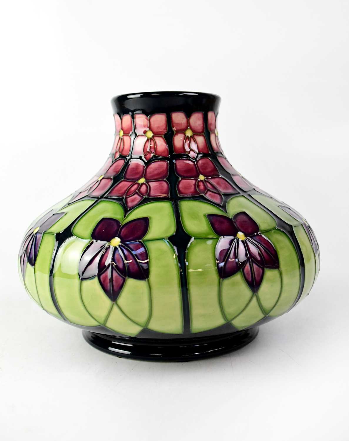 MOORCROFT; a squat baluster vase in tube lined 'Violet' pattern, initialled 'WMPJ' and signed in