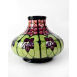 MOORCROFT; a squat baluster vase in tube lined 'Violet' pattern, initialled 'WMPJ' and signed in