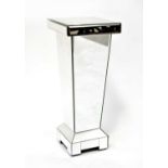 A contemporary mirrored pedestal with bevel edge glass and tapering column, to plinth base, 61 x