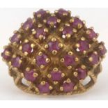 A 9ct gold and ruby ring with five diagonal rows of approximately twenty-three small rubies, size J,