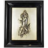 An early 20th century Renaissance-style embossed white metal plaque depicting a Classical maiden