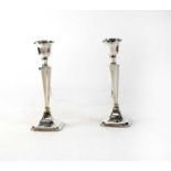 A pair of hallmarked silver candlesticks, Henry Williamson Ltd, Birmingham 1924, height approx. 20cm