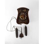 ATTRIBUTED TO JOHANN BAPTISTE BEHA; a 19th century Black Forest cuckoo clock, the dial set with