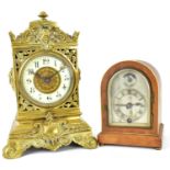 Two vintage desk clocks comprising a mahogany cased dome timepiece, the silvered dome dial set