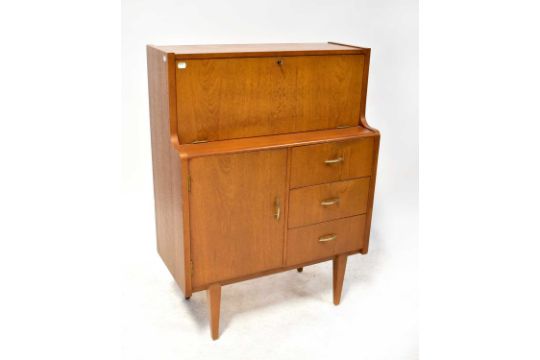 C.W.S. LTD; a 1960s retro teak bureau, fall front enclosing fitted interior  above a base of singl
