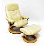 EKORNES; a stressless leather armchair in cream with matching footstool.