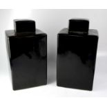 A pair of square-form covered ginger jars with black glaze, height 52cm (2).