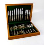 A mahogany cased set of matching and non-matching cutlery, to include knives, forks, spoons,