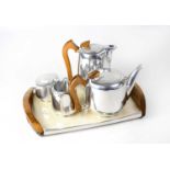 A Picquot ware four-piece tea set and tray with wooden handles, comprising teapot, a hot water