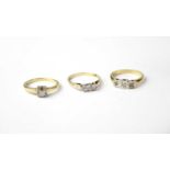 Three 9ct yellow gold rings set with white stones, combined approx. 6.9g (3).