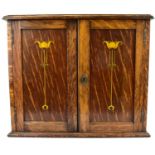 An early 20th century oak tabletop smokers' cabinet with small brass presentation plaque to the top,