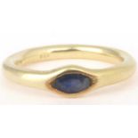 A 14ct gold and sapphire ring, the pavé set marquise cut sapphire in the form of an eye, size O,